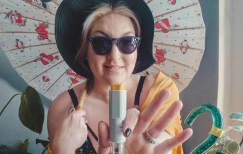Women holding parasol and arthritis medication injection