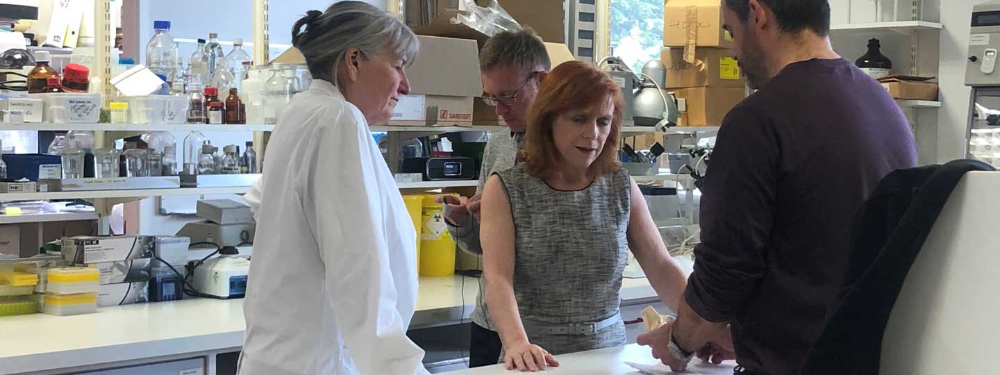 Sally Roberts in the lab with her colleagues.