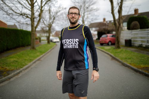 Ian stood in his street in his running clothes