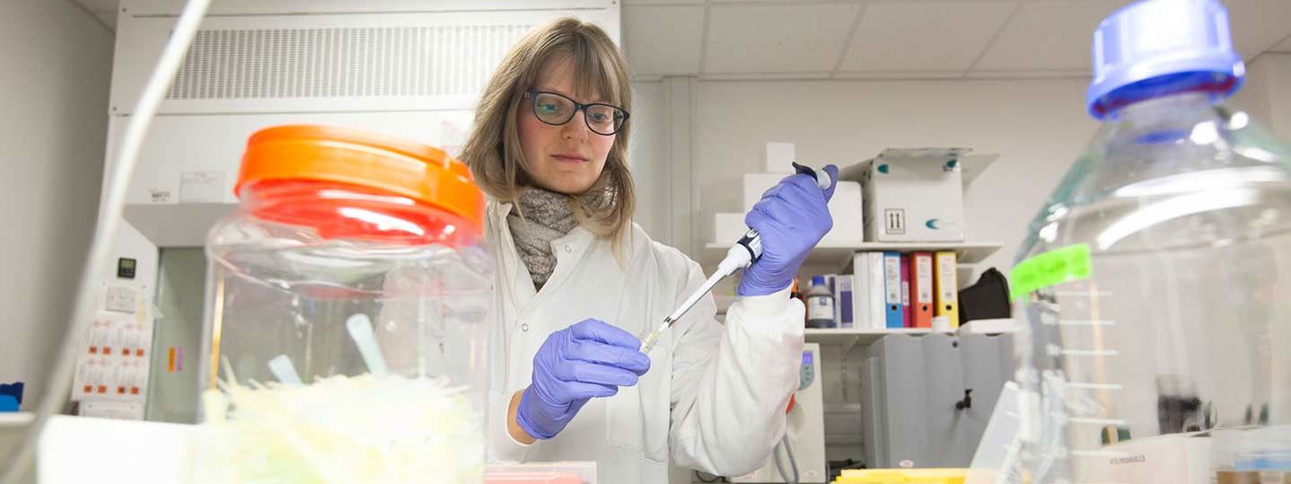 Lady researcher in lab coat