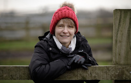 Smiling Sarah wearing knitted bobble hat