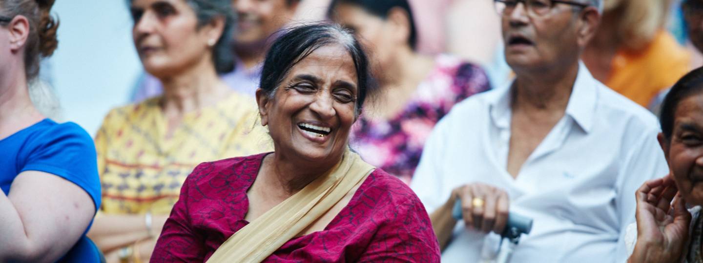 Smiling woman in group meeting
