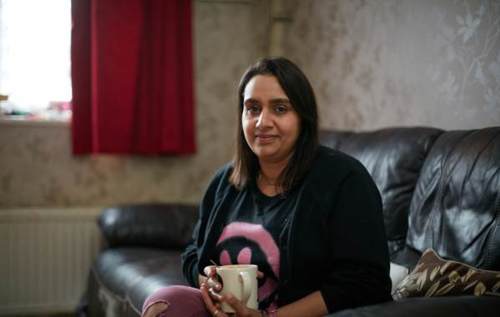 Smiling Priti in living room