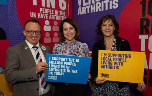 Liz Truss MP, alongside Deborah Alsina, Chief Executive of Versus Arthritis and Andy McGuiness,  Public Affairs Manager at Versus Arthritis