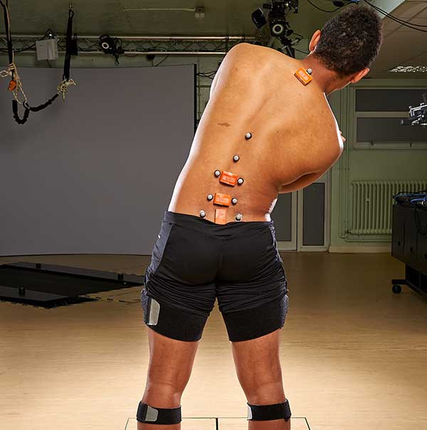 Testing a man's back movement