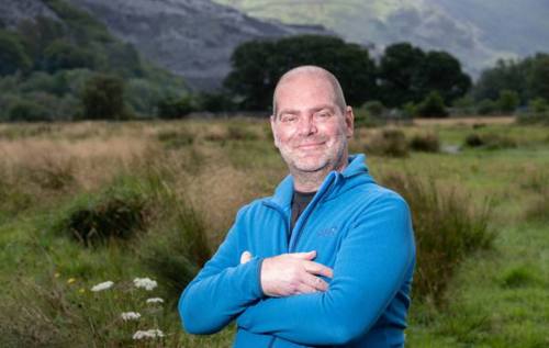 Smiling Dave standing in field