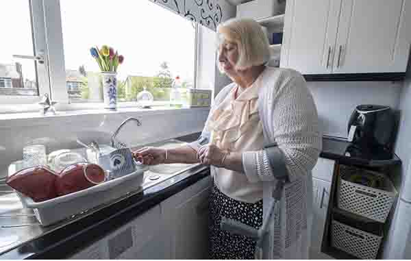 Christine washing dishes