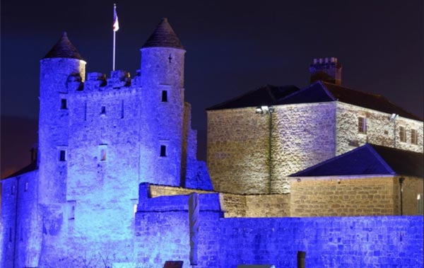 Enniskillen Castle in Northern Ireland lit blue for World Arthritis Day